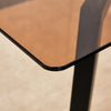 Sleek Brown Glass Dining Table