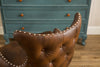 Cozy Brown Barrel Chair with Chic Button Back