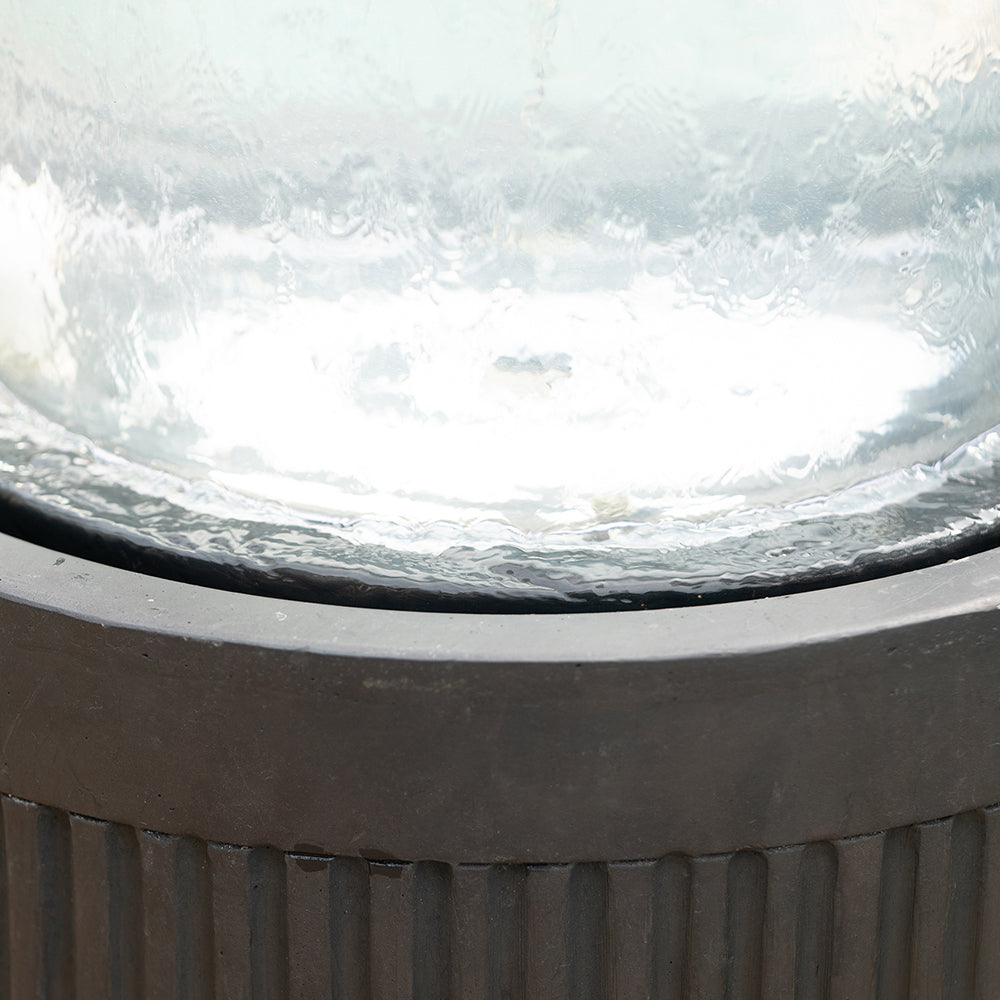 Ribbed Black Cement Outdoor Fountain with Color-Changing Light