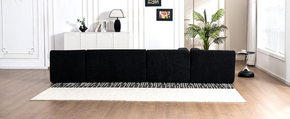 Chic Black Modular Sofa with Loungers and Plush Pillows